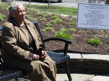 Author Toni Morrison sitting on a bench dedicated in Oberlin, Ohio, in 2009, the second such bench dedicated as part of an initiative launched by the Toni Morrison Society.